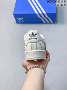 Adidas Superstar White Sneakers with Black Stripes