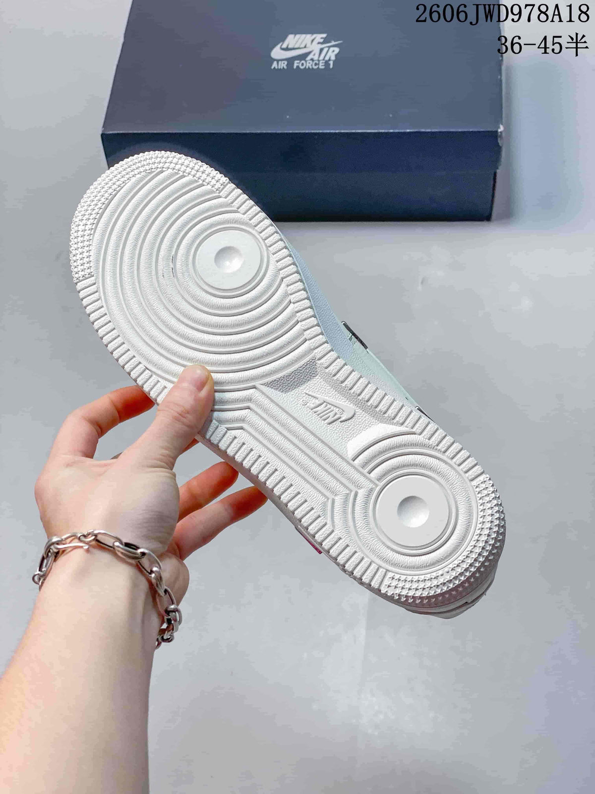 Nike Air Force 1 Low White Sneakers with Metallic Swoosh Details