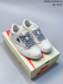 Nike Air Jordan 1 Low Graphic Sneakers in White and Navy