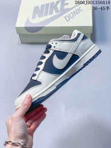 Nike SB Dunk Low Sneakers in Navy and Off-White