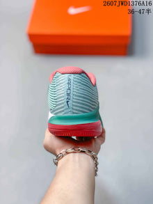 Nike Vapor 12 Low-Top Tennis Sneakers in Mint Green and Coral