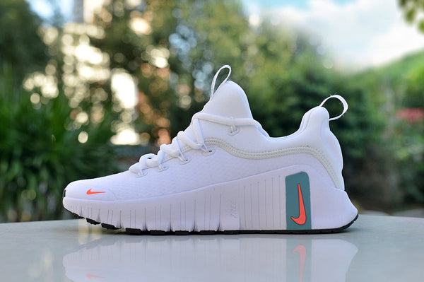 Nike White Low-Top Sneakers with Teal and Coral Accents