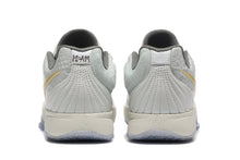 Nike Kyrie Low Basketball Shoes in Gray and Gold