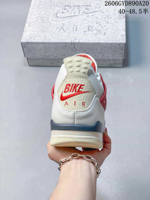 Nike Air Jordan 4 Retro White and Red Mid-Top Sneakers