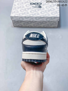 Nike SB Dunk Low Striped Cream and Navy Sneakers