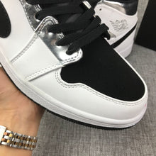 Jordan Air Jordan 1 Mid White Black Metallic Silver Sneakers