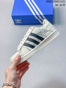 Adidas Superstar White Sneakers with Black Stripes
