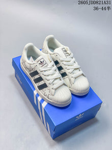 Adidas Superstar White Sneakers with Black Stripes
