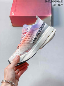 On Cloudboom Strike Running Shoes in Coral and Lilac