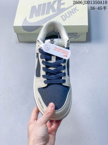 Nike SB Dunk Low Sneakers in Navy and Off-White
