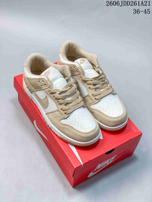 Nike Dunk Low Sneakers in White and Beige