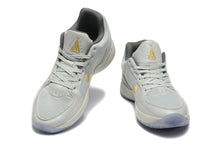 Nike Kyrie Low Basketball Shoes in Gray and Gold