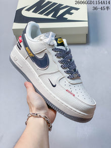 Nike Air Force 1 White Sneakers with Dark Swoosh Details