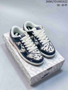 Nike SB Dunk Low Striped Cream and Navy Sneakers