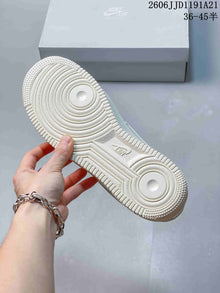 Nike Air Force 1 Low White Sneakers with Black Mini Swoosh