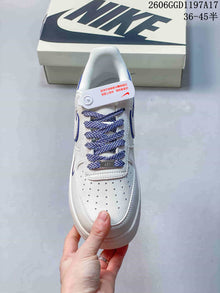 Nike Air Force 1 Low x Stüssy White and Navy Sneakers