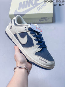 Nike SB Dunk Low Sneakers in Navy and Off-White