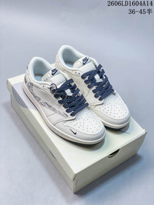 Nike Air Jordan 1 Low Graphic Sneakers in White and Navy