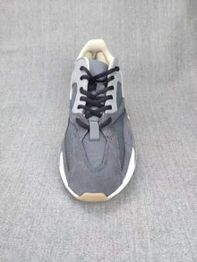 700 Grey Lifestyle Sneakers with Orange Accents