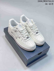 Nike Air Force 1 Low White Sneakers with Metallic Accents
