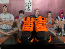 Jordan Black and Orange High-Top Basketball Sneakers