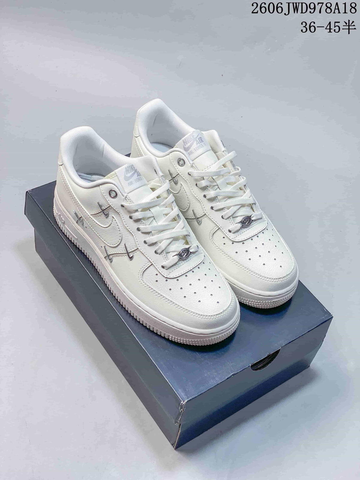 Nike Air Force 1 Low White Sneakers with Metal Swoosh Details