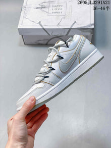Air Jordan 1 Low White and Grey Sneakers with Gold Accents