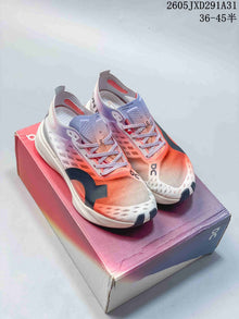 On Cloudboom Strike Running Shoes in Coral and Lilac