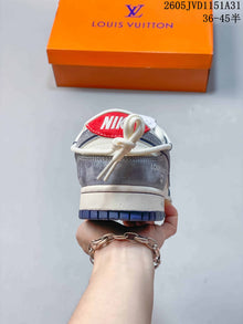 Nike SB Dunk Low Sneakers in White, Gray and Navy