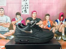 Nike Black Low-Top Sneakers with Metallic Swoosh