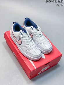 NikeCourt Borough 2 Low GS Sneakers in White and Pink